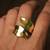 Curved gold tone statement ring