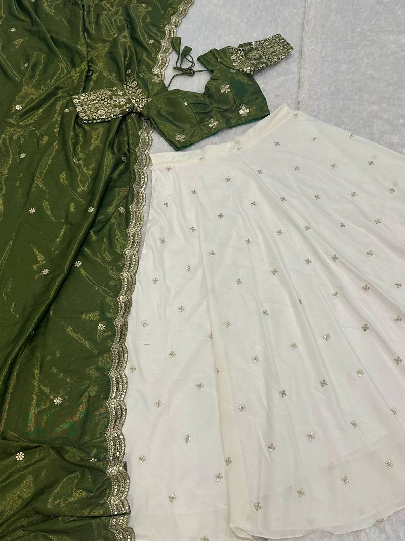 off white silk lehenga with green zari blouse