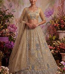 beige embroidered net unstitched lehenga choli with dupatta