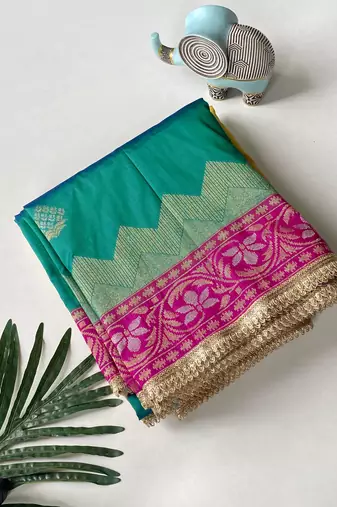 emerald green color zari weaves contrast pallu and designer chaap border silk blend saree