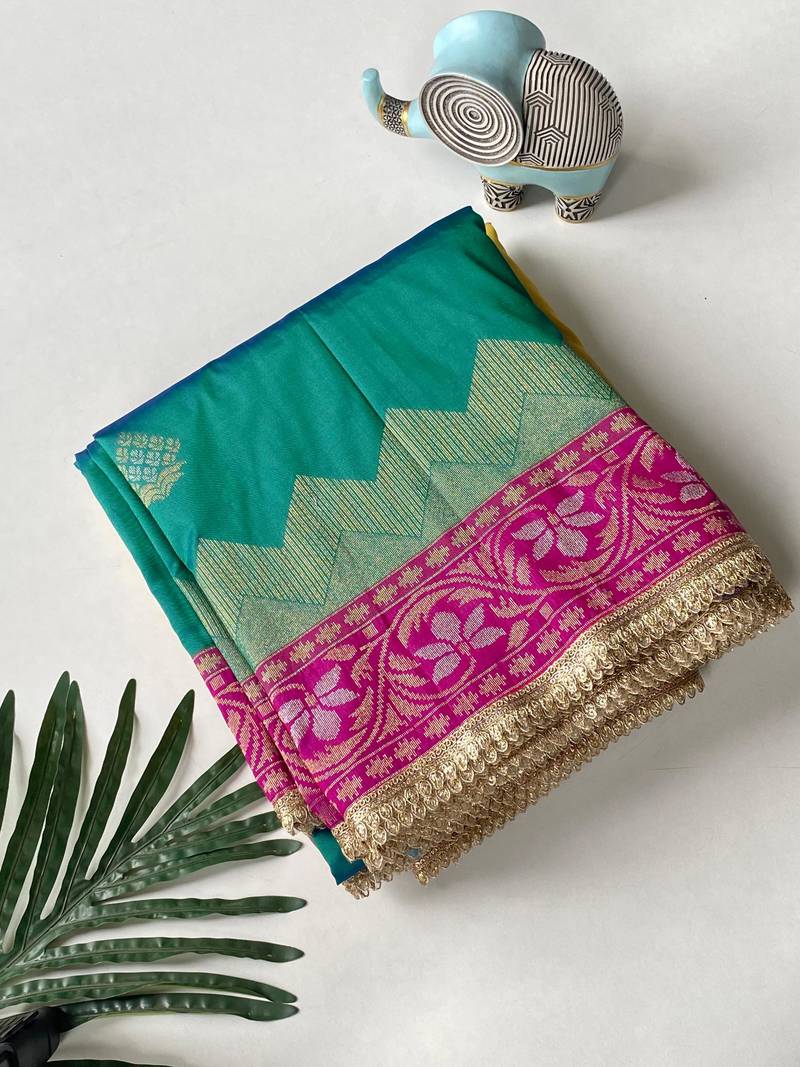 emerald green color zari weaves contrast pallu and designer chaap border silk blend saree