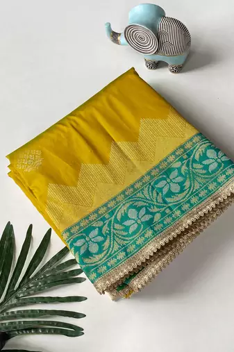 mustard yellow color zari weaves contrast pallu and designer chaap border silk blend saree