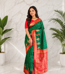dark green color contrast weaving pallu and border kanchi weaving buttis on border silk blend saree