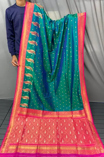 dark green color contrast weaving pallu and border kanchi weaving buttis on border silk blend saree