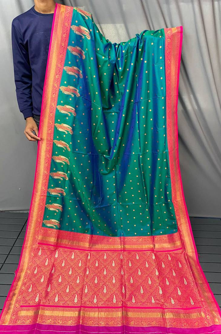 dark green color contrast weaving pallu and border kanchi weaving buttis on border silk blend saree