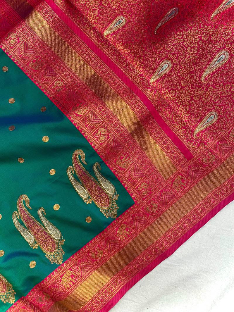 dark green color contrast weaving pallu and border kanchi weaving buttis on border silk blend saree