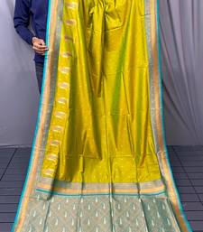 olive green color contrast weaving pallu and border kanchi weaving buttis on border silk blend saree