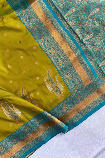 olive green color contrast weaving pallu and border kanchi weaving buttis on border silk blend saree