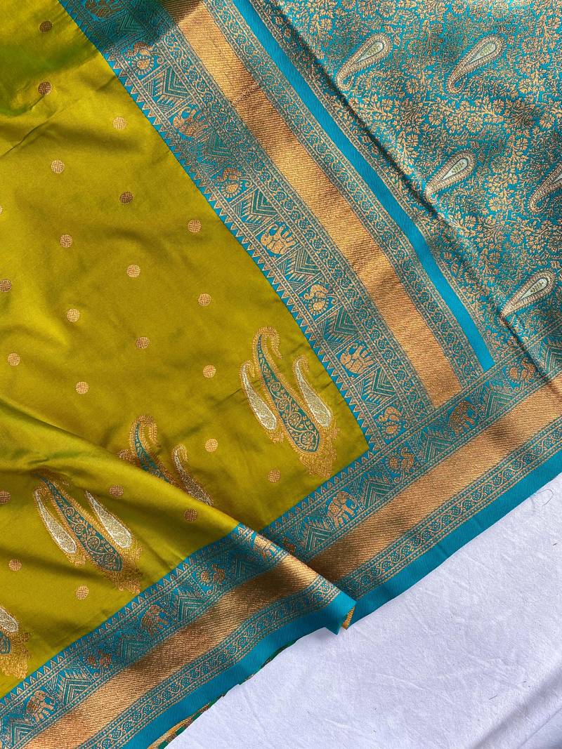 olive green color contrast weaving pallu and border kanchi weaving buttis on border silk blend saree