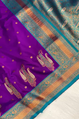 purple color contrast weaving pallu and border kanchi weaving buttis on border silk blend saree