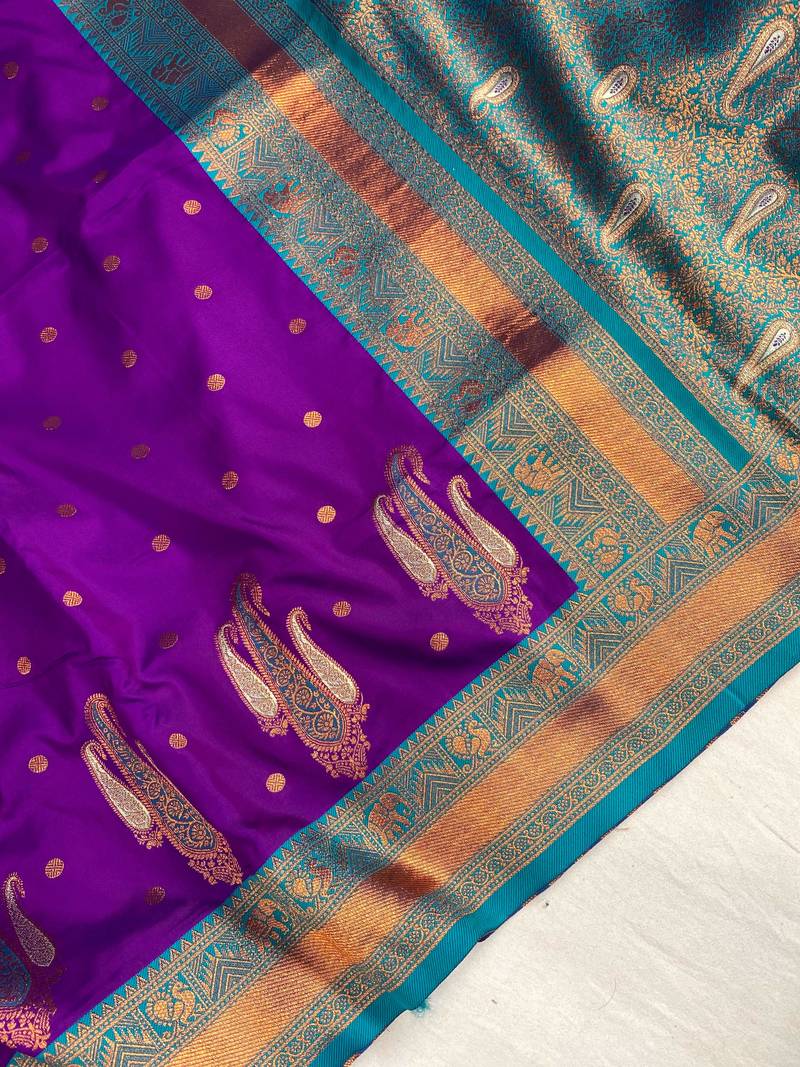 purple color contrast weaving pallu and border kanchi weaving buttis on border silk blend saree