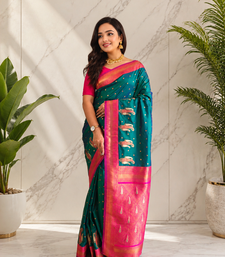 teal color contrast weaving pallu and border kanchi weaving buttis on border silk blend saree