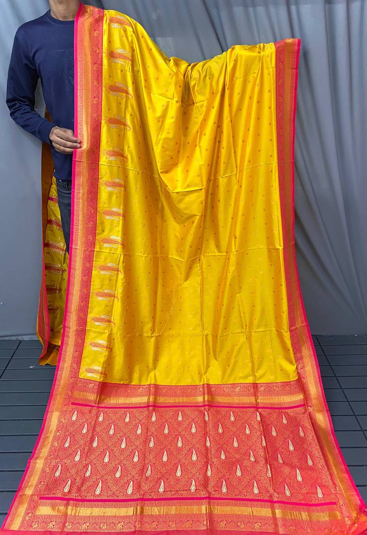 yellow color contrast weaving pallu and border kanchi weaving buttis on border silk blend saree