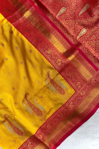 yellow color contrast weaving pallu and border kanchi weaving buttis on border silk blend saree