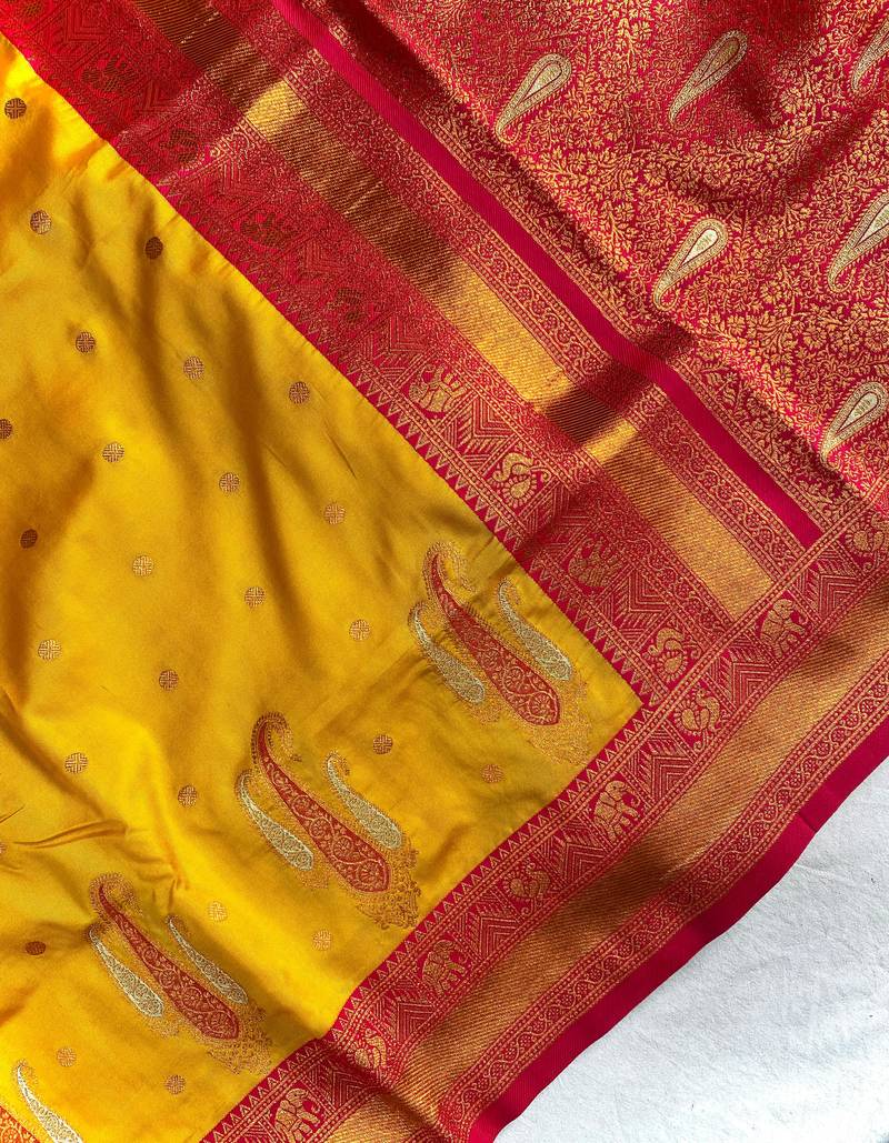 yellow color contrast weaving pallu and border kanchi weaving buttis on border silk blend saree