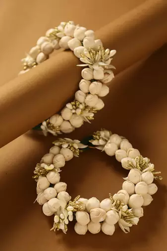 Traditional white jasmine mogra gajra hair accessory with gold touches