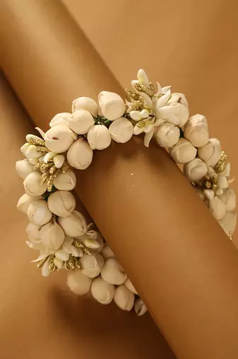 Traditional white jasmine mogra gajra hair accessory with gold touches