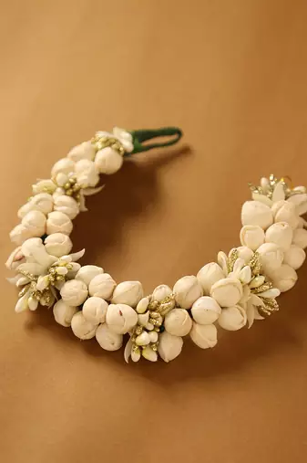 Traditional white jasmine mogra gajra hair accessory with gold touches