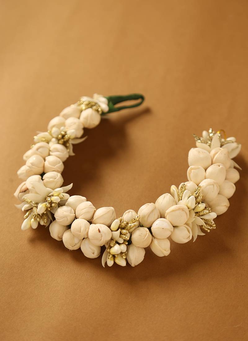 Traditional white jasmine mogra gajra hair accessory with gold touches