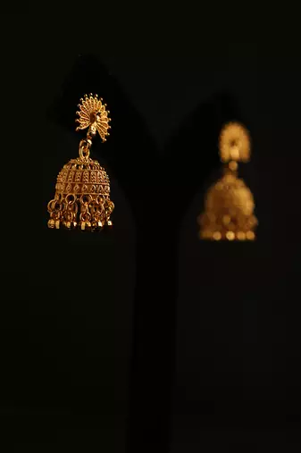 Antique gold floral mandala jhumka earrings with black beads