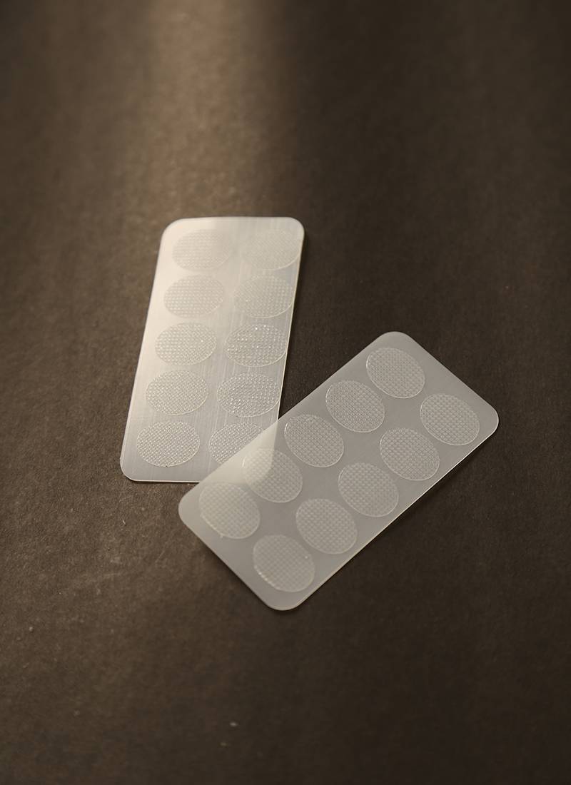 Invisible ear lobe support patches for heavy earring relief