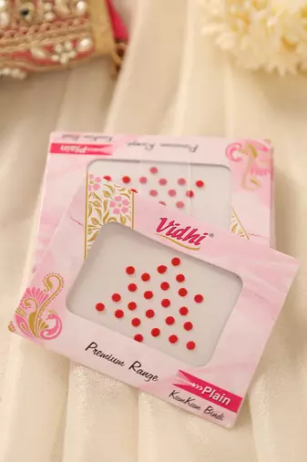 Classic red round kumkum bindi pack for traditional indian wear