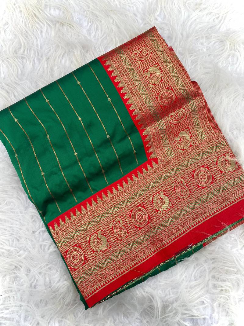 green color rich contrast weaving pallu and border kanchi weaving buttis on border silk blend saree