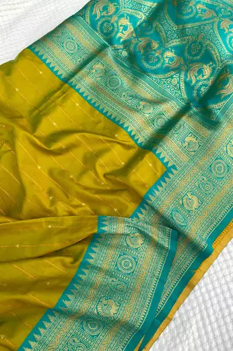 mustard yellow color rich contrast weaving pallu and border kanchi weaving buttis on border silk blend saree