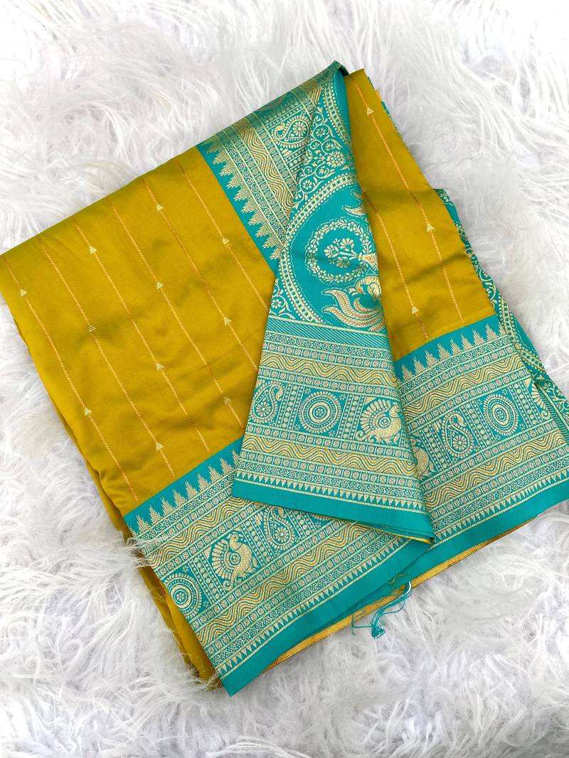 mustard yellow color rich contrast weaving pallu and border kanchi weaving buttis on border silk blend saree