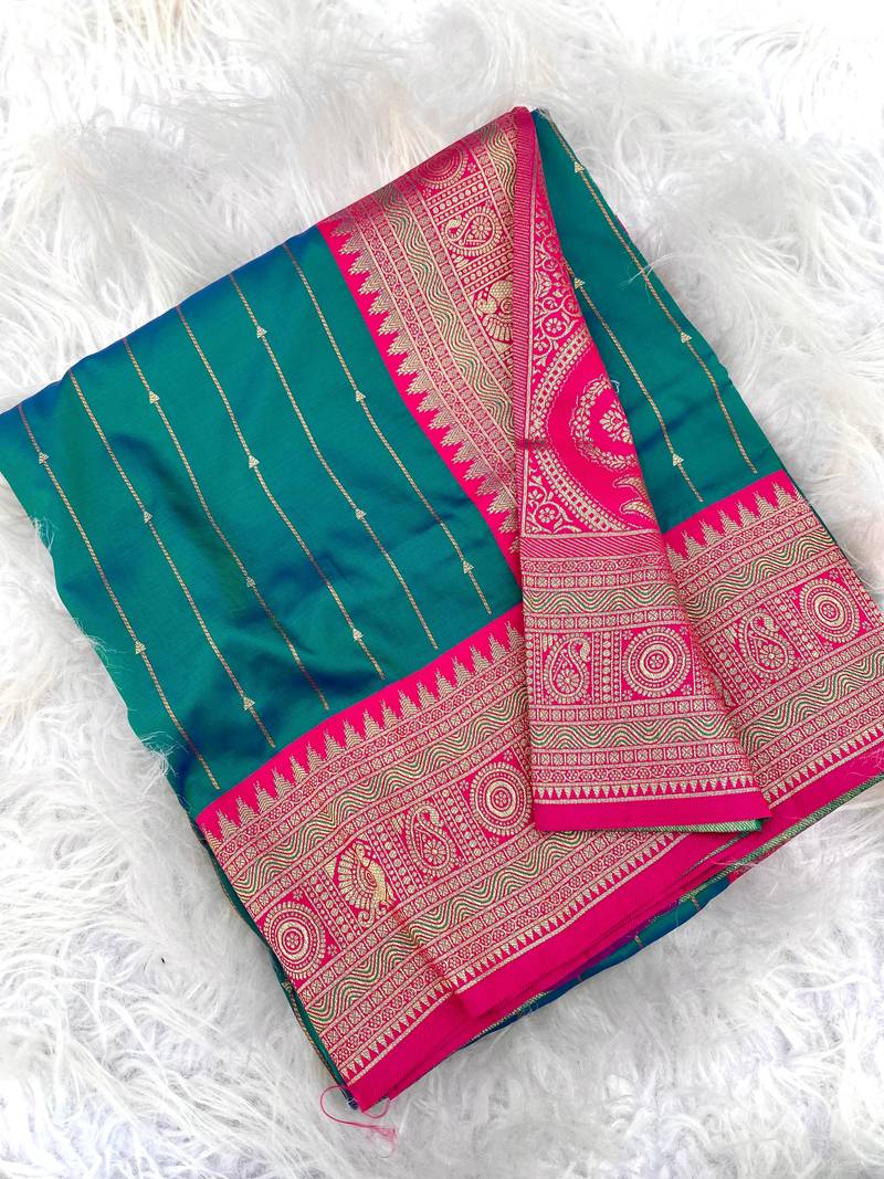 sea green color rich contrast weaving pallu and border kanchi weaving buttis on border silk blend saree