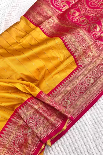yellow color rich contrast weaving pallu and border kanchi weaving buttis on border silk blend saree