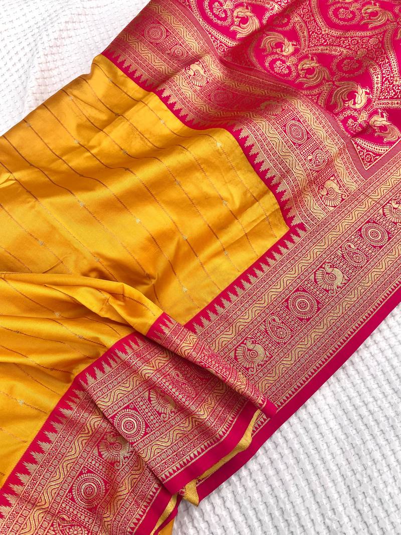 yellow color rich contrast weaving pallu and border kanchi weaving buttis on border silk blend saree
