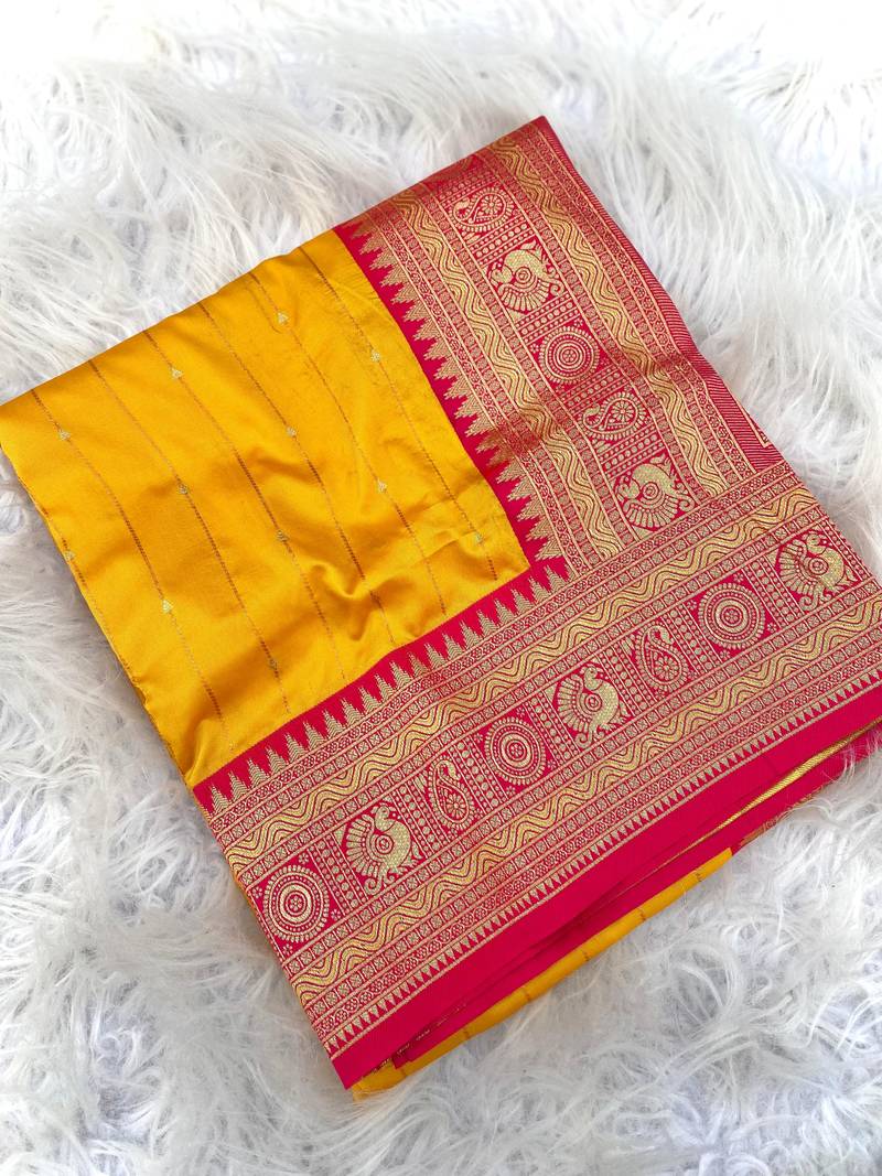 yellow color rich contrast weaving pallu and border kanchi weaving buttis on border silk blend saree