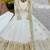 White georgette embroidered flared gown set