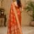 Sangam prints rust orange satin woven work traditional saree