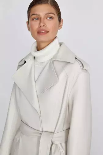 Women’s mid-length belted leather white trench-style coat 