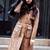 Women’s full-length safari-inspired leather trench coat burnished warm cognac brown
