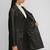 Women’s black full-length safari-inspired leather trench coat