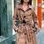 Women’s black furr collar  full-length safari-inspired leather trench coat