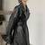 Women’s avant-garde longline black leather trench coat oversized silhouette