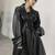 Women’s avant-garde longline black leather trench coat oversized silhouette