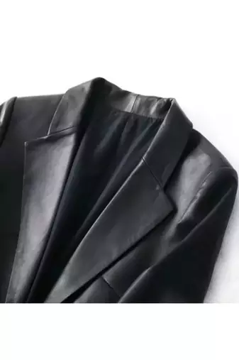 Women’s black leather trench style coat button style