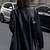 Women’s trench style black mid-length leather coat