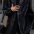 Women’s trench style black mid-length leather coat