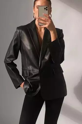 Women’s  style black mid-length leather trench coat oversized