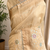 Cream Embroidery Beats Sequin Floral Work And Lightweight Tissue Linen Saree With Unstitched Blouse