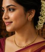 South indian gold plated floral stud earrings with pink & green kemp stones