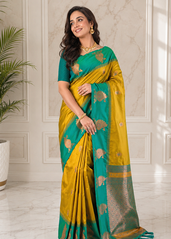 mustard yellow color zari weaves motifs in border and contrast pallu and designer chaap border silk blend saree