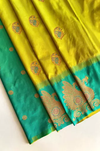 mustard yellow color zari weaves motifs in border and contrast pallu and designer chaap border silk blend saree