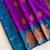 violet color zari weaves motifs in border and contrast pallu and designer chaap border silk blend saree